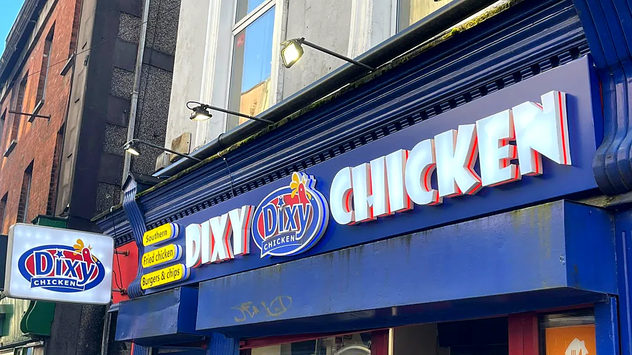 Dixy Chicken in Cork: white 3D built-up letters with red returns on a navy fascia.